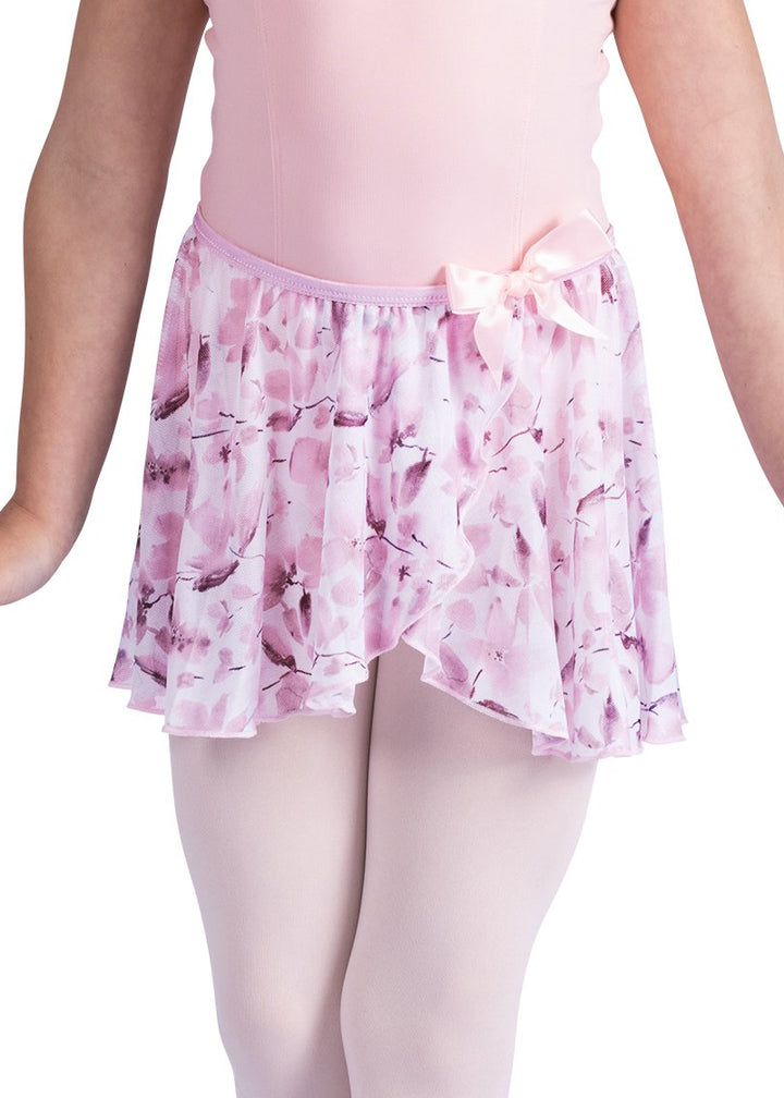 Danznmotion by Danshuz 26407C Girls' Meadow Floral Mock Wrap Georgette Youth Pull-On Skirt in Pink, shown on a young girl wearing a matching light pink leotard