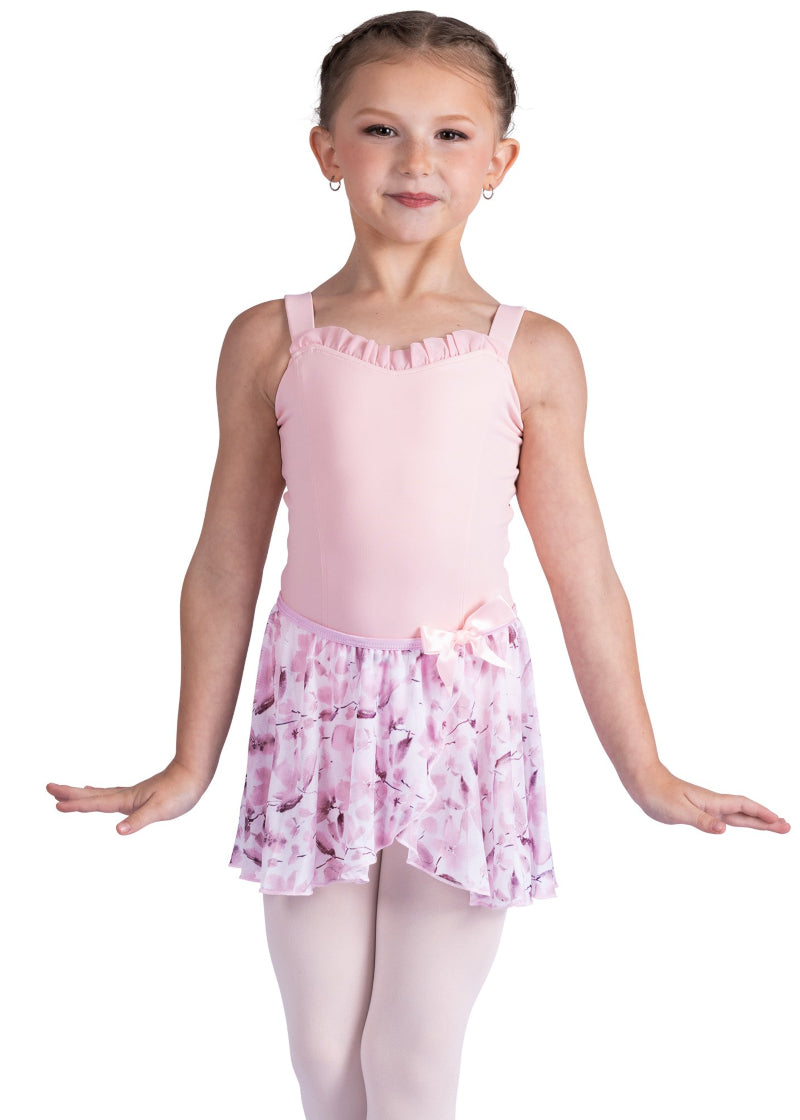 Danznmotion by Danshuz 26407C Girls' Meadow Floral Mock Wrap Georgette Youth Pull-On Skirt in Pink, shown on a young girl wearing a matching light pink leotard