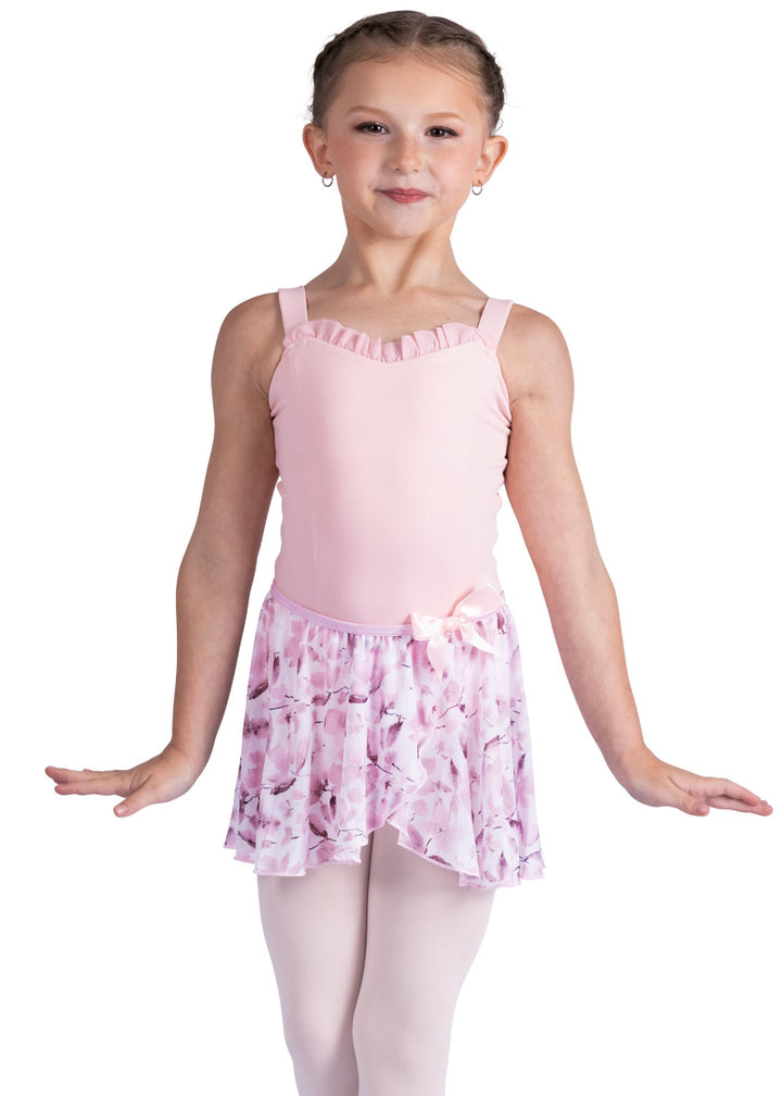 Danznmotion by Danshuz 26407C Girls' Meadow Floral Mock Wrap Georgette Youth Pull-On Skirt in Pink, shown on a young girl wearing a matching light pink leotard