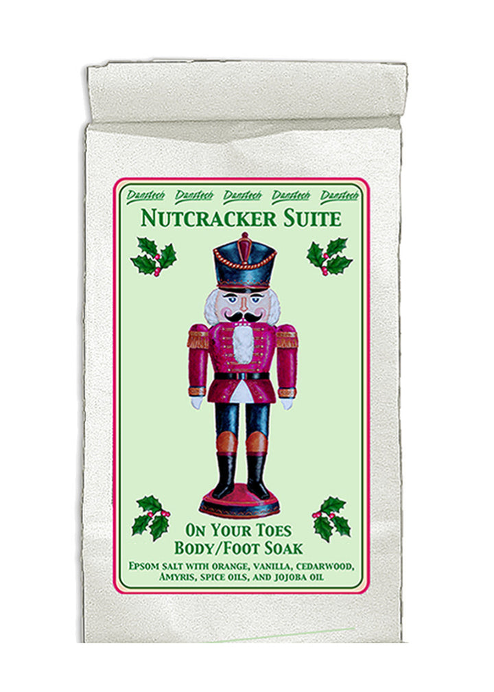 Danztech On Your Toes Epsom Salt Foot and Body Soak in the Nutcracker Suite scent: a zesty blend of citrus, vanilla, cedarwood, and spice oils with moisturizing jojoba oil