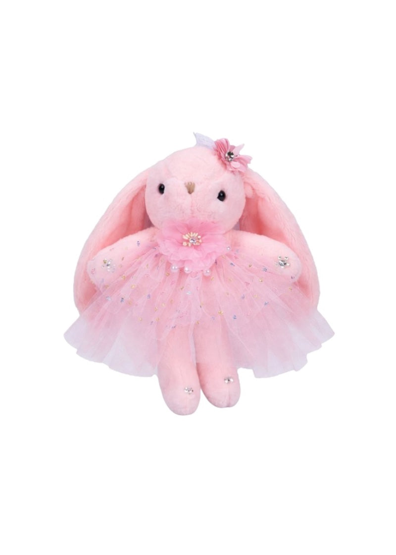 Dasha Designs pink stuffed bunny with pink tutu and pink flower accessories.