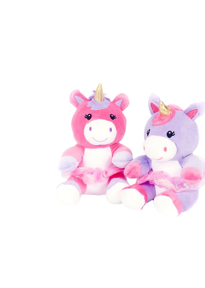 Dasha Designs pink stuffed unicorn with light purple and white accents, gold horn, and pink tutu.