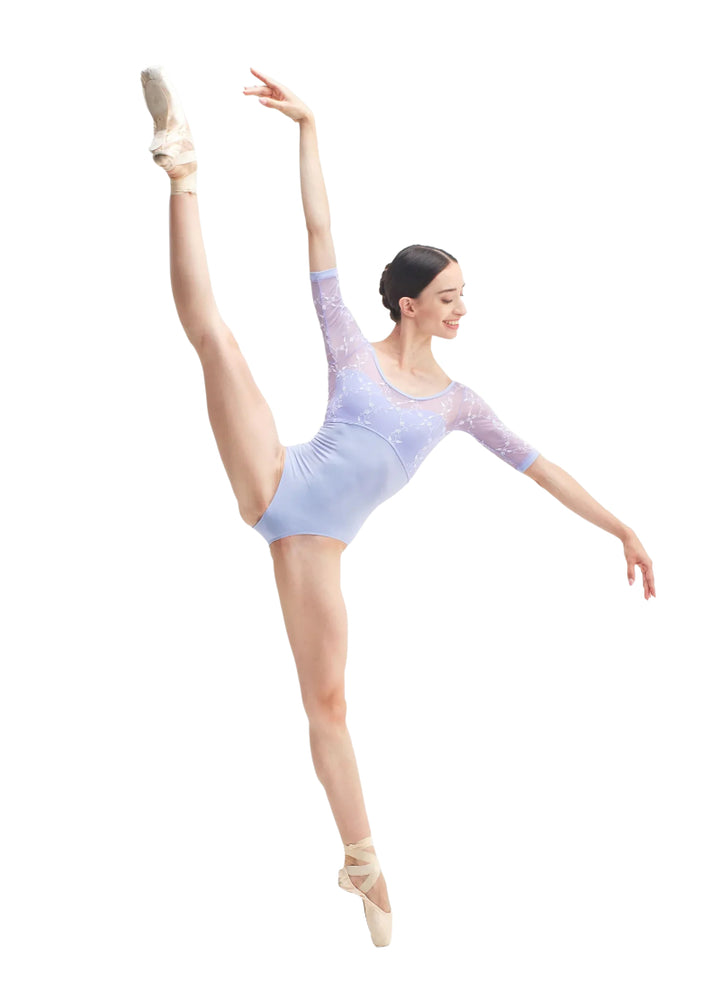 DellaLo' Milano Icons CD26063-1 Women's Svetlana Leotard with floral embroidered mesh half-sleeves in Violetta Lavender, modelled on a ballet dancer en pointe