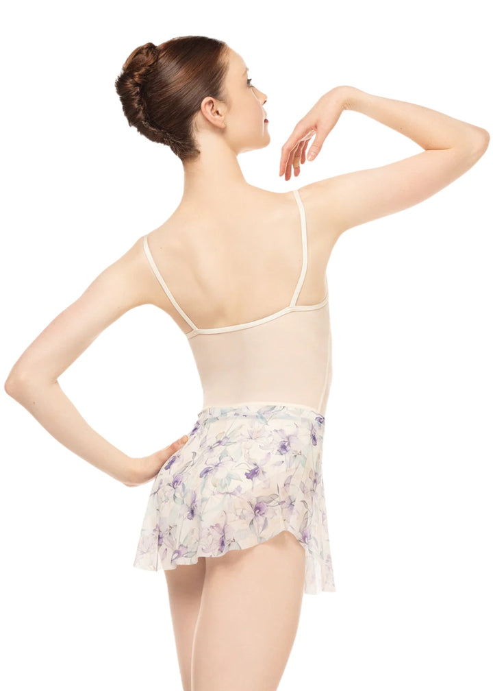 Eleve Dancewear Women's Calla Stretch Mesh Pull-On Skirt with tulip hemline and beautiful cream and purple floral print, shown on a ballet dancer