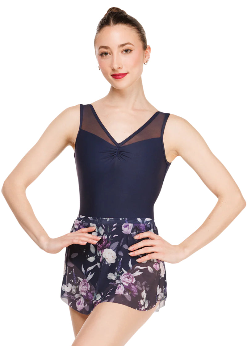 Eleve Dancewear Moonlit Garden Women's Fabiola Pinch Front Mesh Tank Leotard in Dark Navy Blue, shown on a ballet dancer also wearing the complimentary Moonlit Garden Floral Print Mesh Tulip Skirt