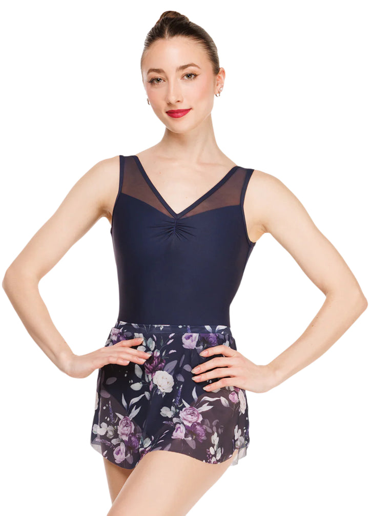 Eleve Dancewear Moonlit Garden Women's Fabiola Pinch Front Mesh Tank Leotard in Dark Navy Blue, shown on a ballet dancer also wearing the complimentary Moonlit Garden Floral Print Mesh Tulip Skirt