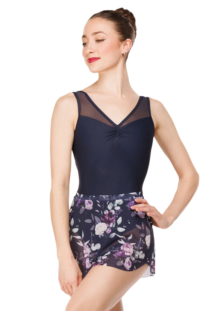 Eleve Dancewear Moonlit Garden Women's Fabiola Pinch Front Mesh Tank Leotard in Dark Navy Blue, shown on a ballet dancer also wearing the complimentary Moonlit Garden Floral Print Mesh Tulip Skirt