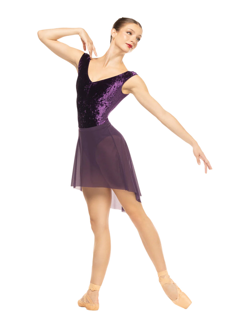 Eleve Dancewear Moonlit Garden Women's Sophia Crushed Velvet Pinch Front Cap Sleeve Leotard in Eggplant purple, shown on a ballet dancer with matching skirt