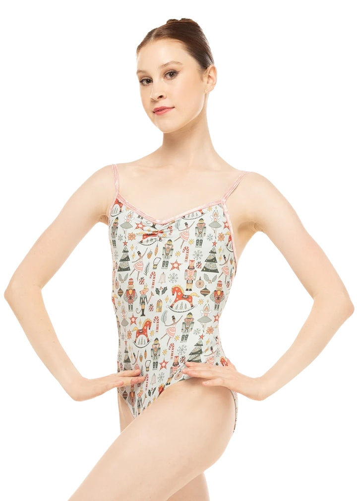 Eleve Nolte camisole leotard in sage green with holiday themed pattern, pinch front neckline, and light pink velvet straps and trim