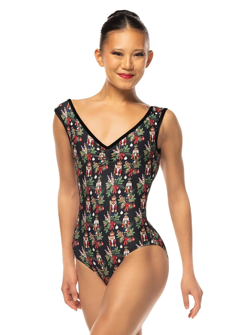 Eleve Stellar cap sleeve leotard in black with a Nutcracker and tree branch pattern and a pinch front V neckline
