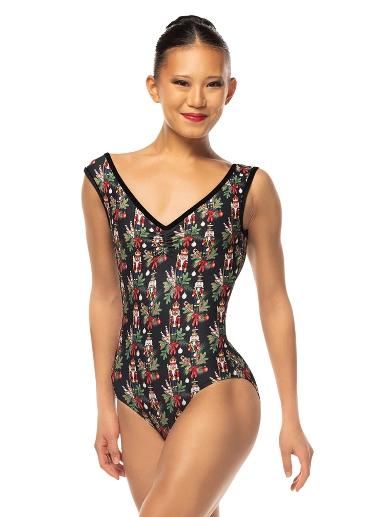 Eleve Stellar cap sleeve leotard in black with a Nutcracker and tree branch pattern and a pinch front V neckline