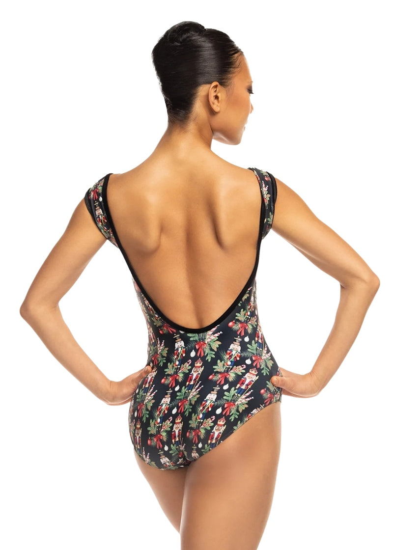 Eleve Stellar cap sleeve leotard in black with a Nutcracker and tree branch pattern and a low back