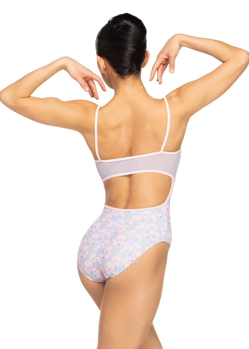 Eleve Dancewear Women's Helena Camisole Leotard in a multicolor floral print with mesh keyhole low-cut back, modelled on a ballet dancer