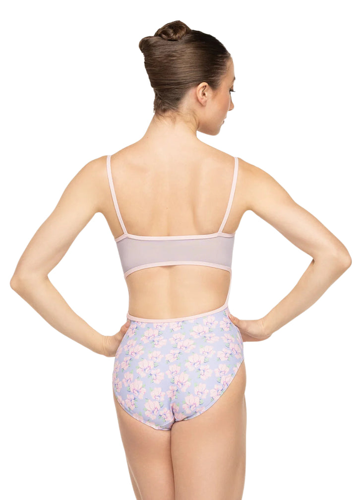 Eleve Dancewear Women's Helena Camisole Leotard in a multicolor floral print with mesh keyhole low-cut back, modelled on a ballet dancer