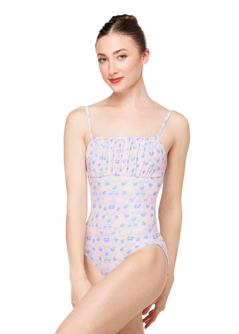 Eleve Dancewear Women's Cassandra Floral Print Camisole Leotard in Garden Dance Pink, Blue, and Green, shown on a ballet dancer