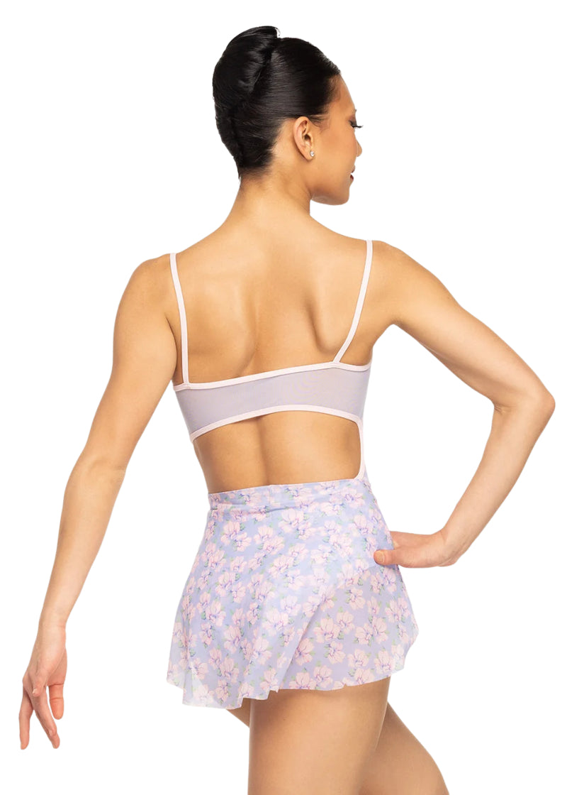 Eleve Dancewear Women's Petal Floral Print Skirt in Floral Toss Pink, Green, and Lavender Print, shown on a ballet dancer wearing the matching Helena Floral Camisole Leotard