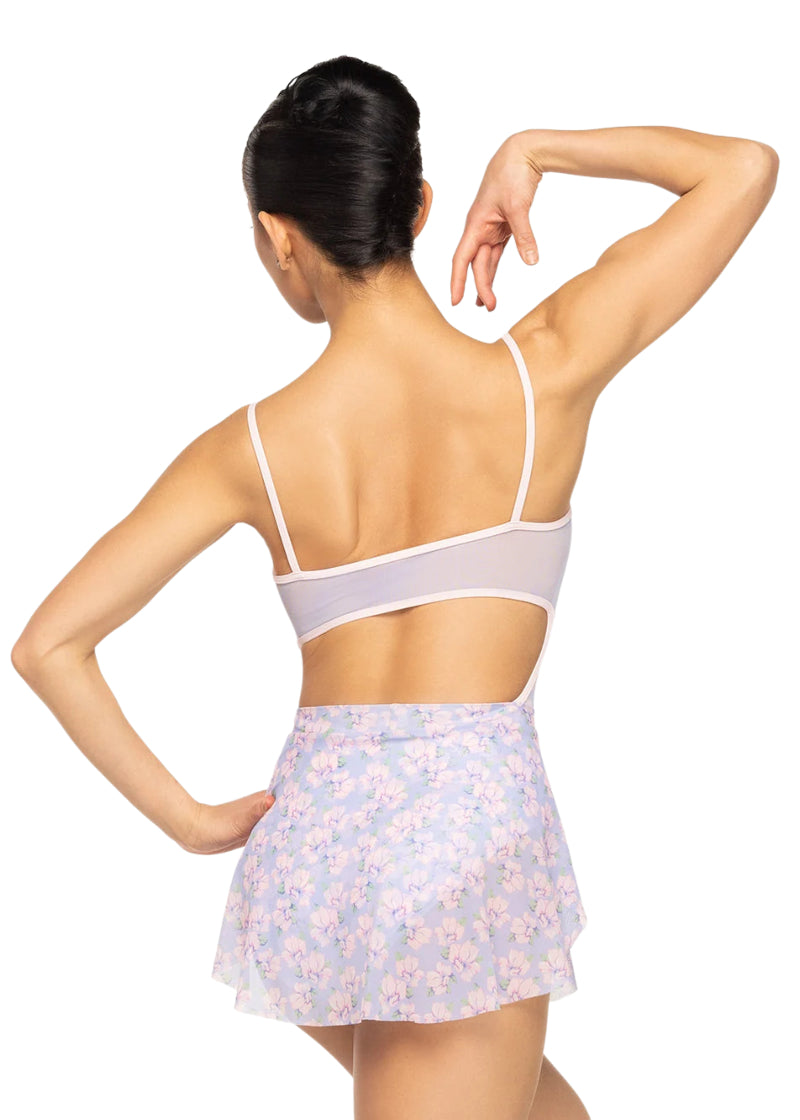 Eleve Dancewear Women's Petal Floral Print Skirt in Floral Toss Pink, Green, and Lavender Print, shown on a ballet dancer wearing the matching Helena Floral Camisole Leotard