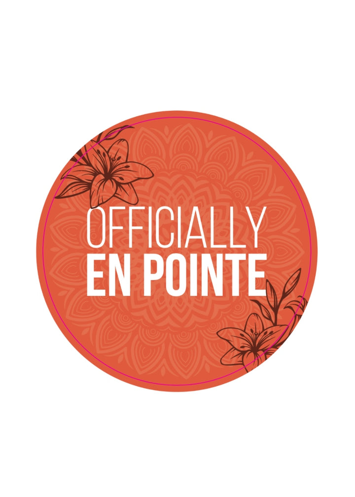 orange pin with floral pattern and the words "officially en pointe"