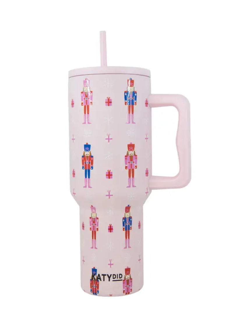 travel tumbler with straw and handle in light pink with nutcracker pattern