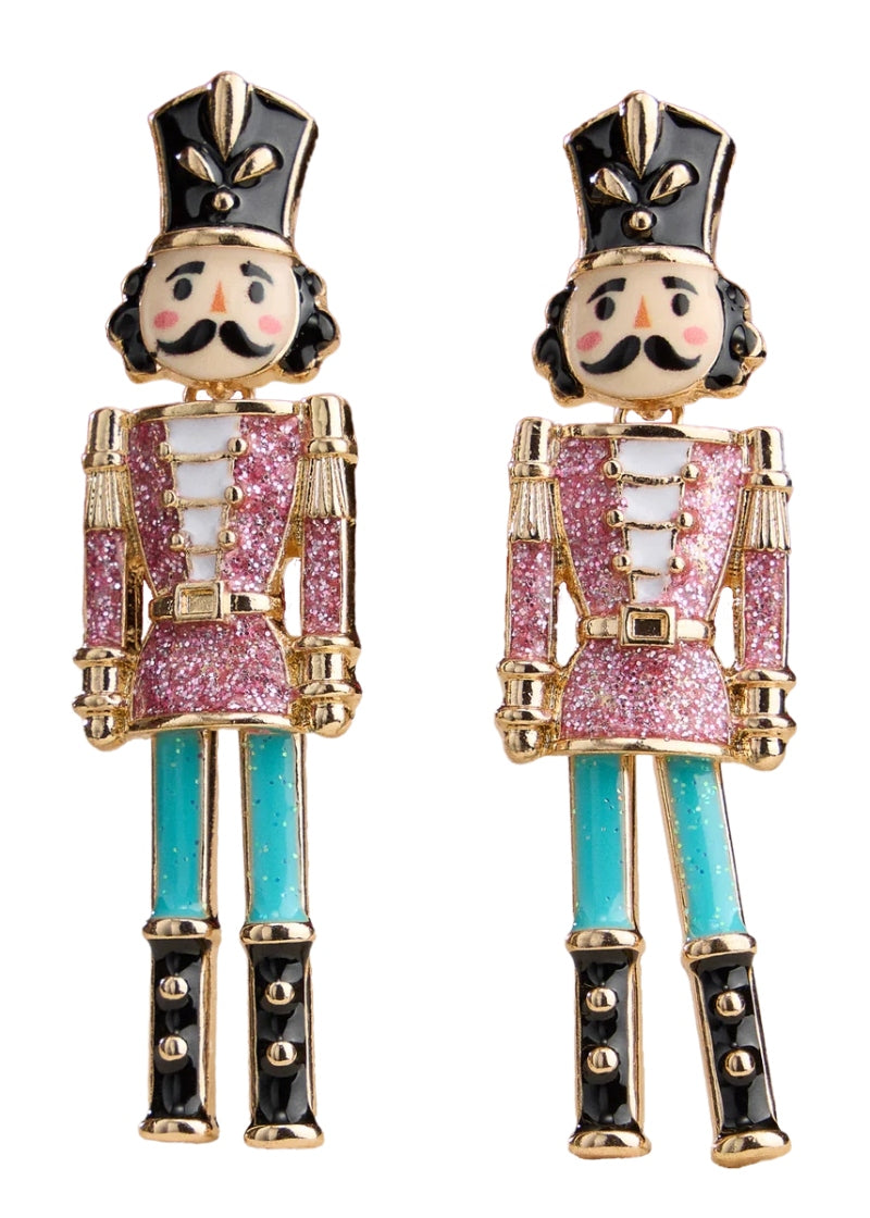 gold plated, enameled nutcracker-shaped earrings with post attachment