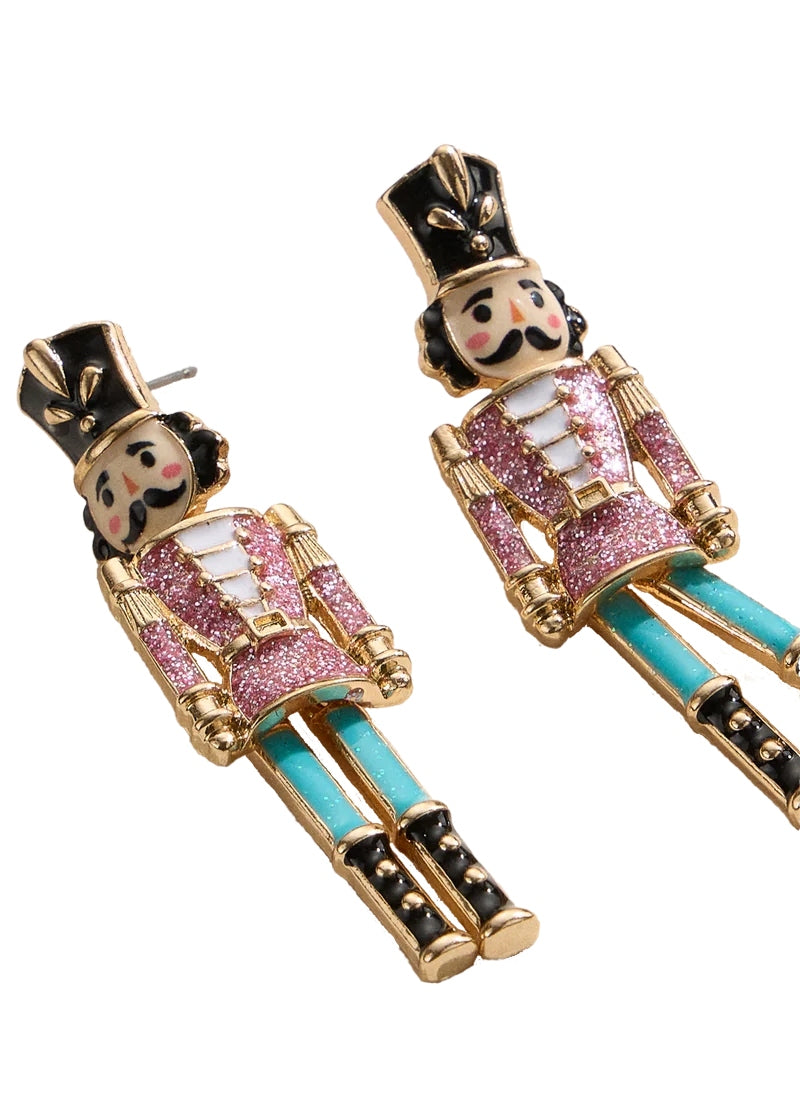 gold plated, enameled nutcracker-shaped earrings with post attachment