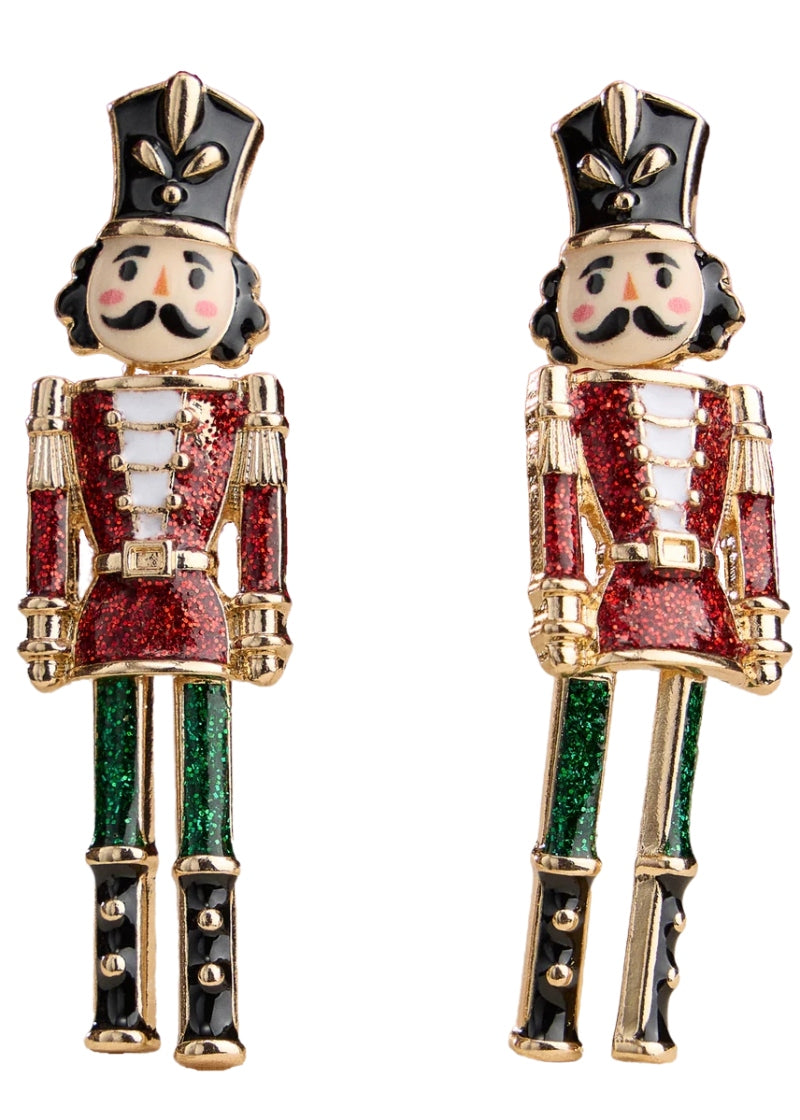 gold plated, enameled nutcracker-shaped earrings with post attachment