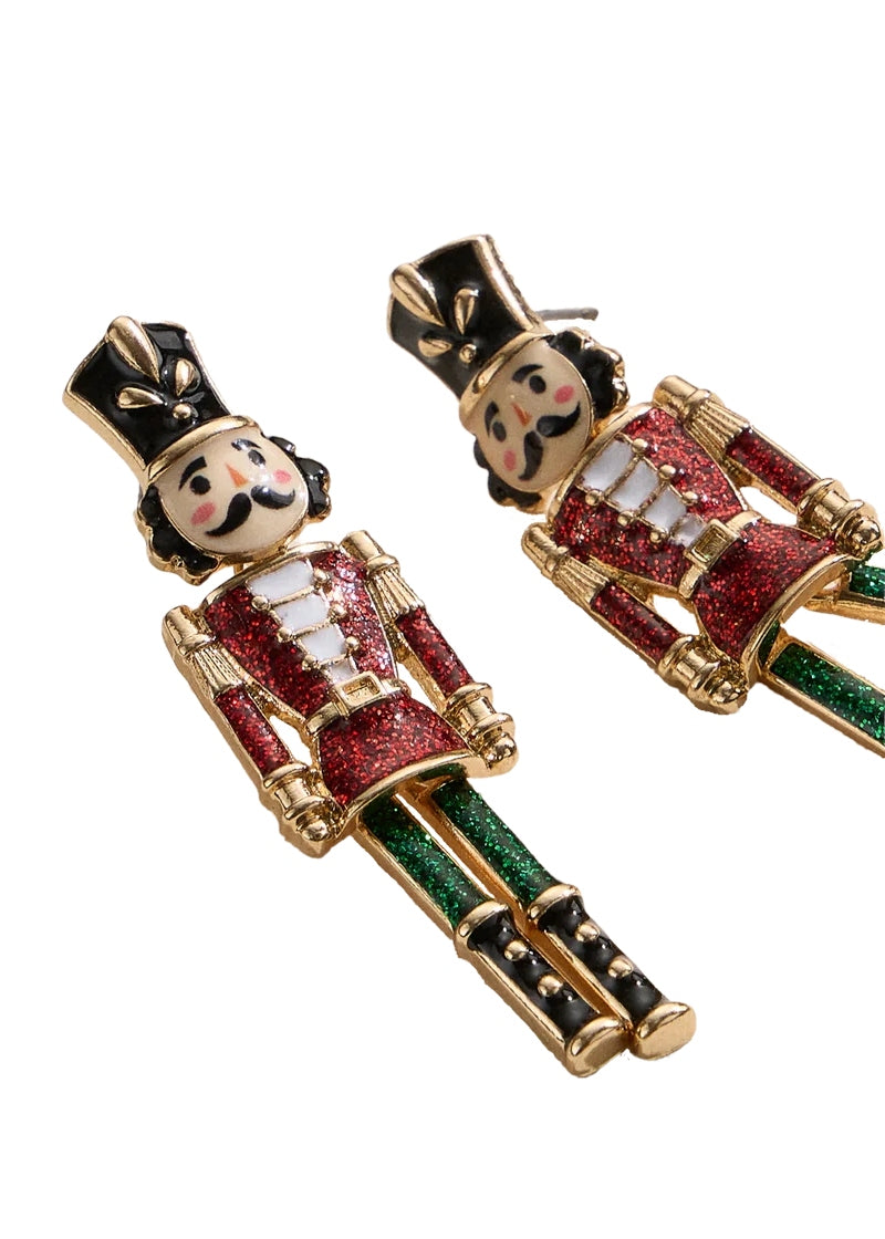 gold plated, enameled nutcracker-shaped earrings with post attachment