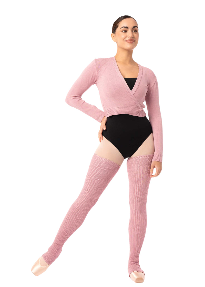 Intermezzo 2041 Women's Francisco Knit Stretch Bamboo Thigh-High Stirrup Legwarmers in Pink, shown on a ballet dancer wearing pointe shoes, pink tights, a black leotard, and a matching pink wrap sweater
