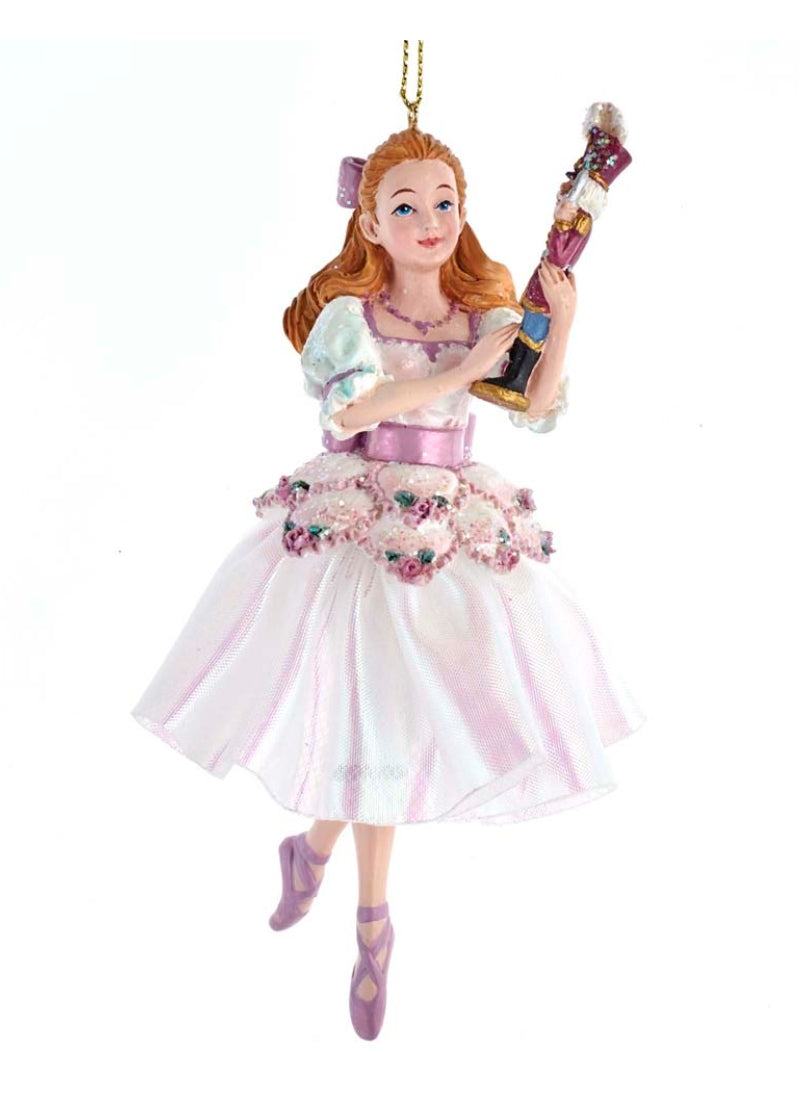 Clara tree ornament with light purple dress holding miniature nutcracker 