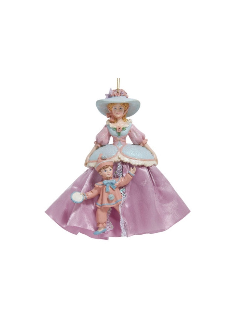 Holiday ornament Mother Ginger in purple dress and blue hat with pink polichinelle emerging from her skirt.