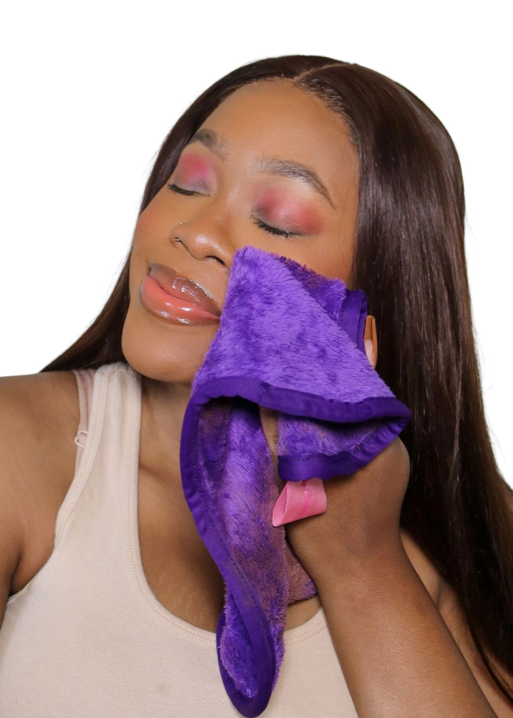 The Original MakeUp Eraser RTX01 MakeUp Eraser PRO in Queen Purple being used by a woman to effortlessly remove her make-up