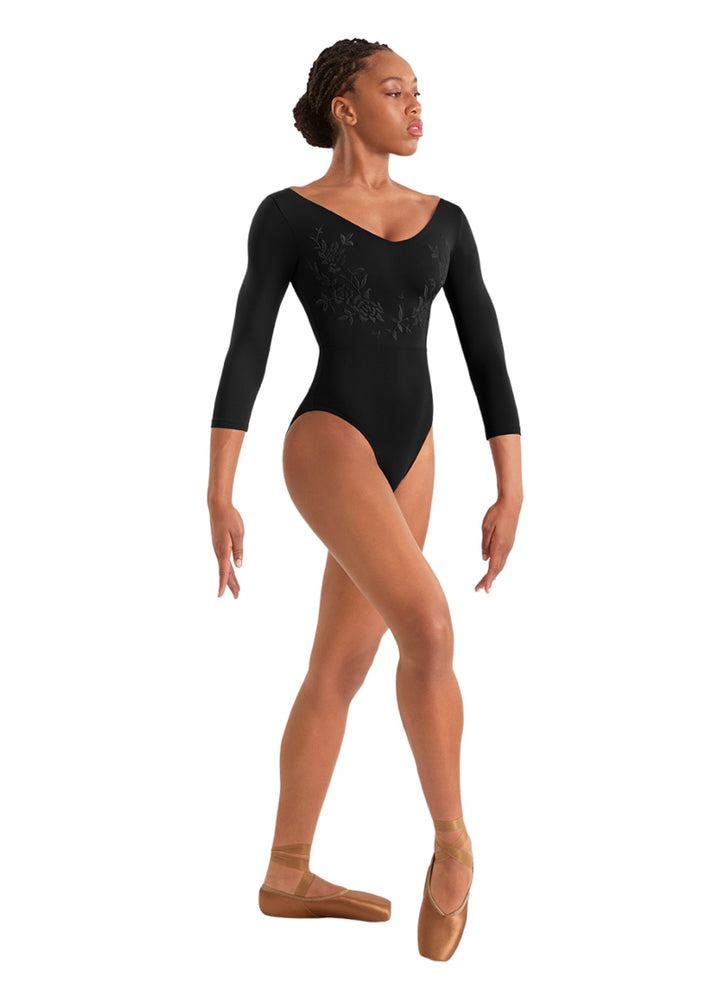 Mirella women's 3/4 sleeve leotard in black with v-neckline and floral embroidery.