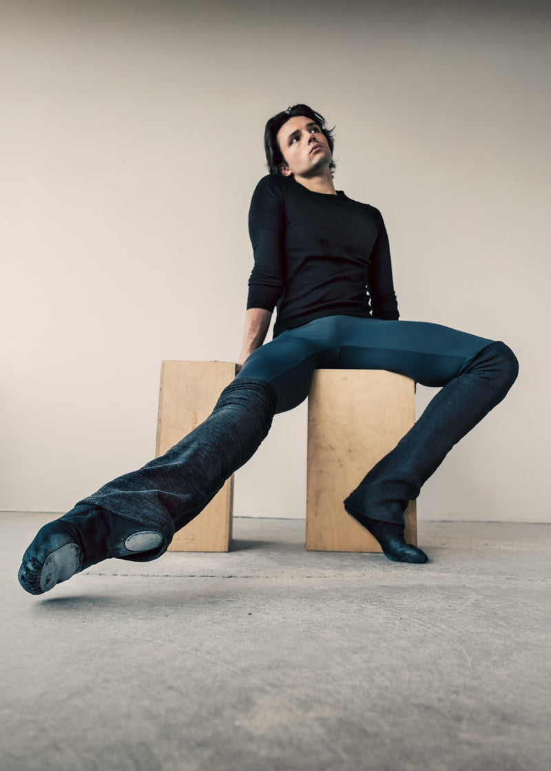 Orza Pro 2.0 Men's Split-Sole Canvas Ballet Shoe in Black with shock-absorbing materials, shown on a male dancer