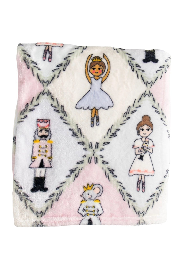 Fleece blanket with nutcracker character art in pastel argyle pattern.