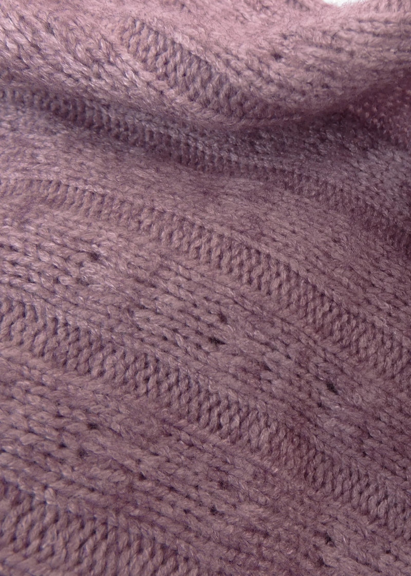 close-up view of RubiaWear Rosewater dusty pink cable knit fabric