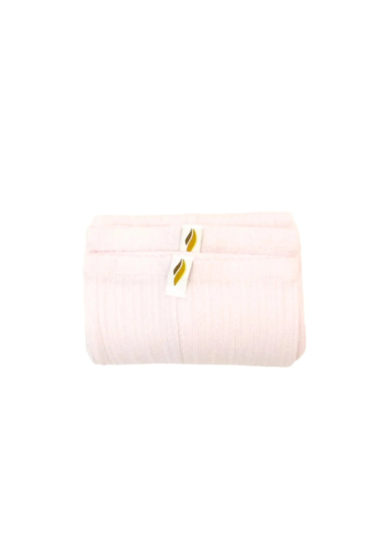RubiaWear legwarmers in pale pink.