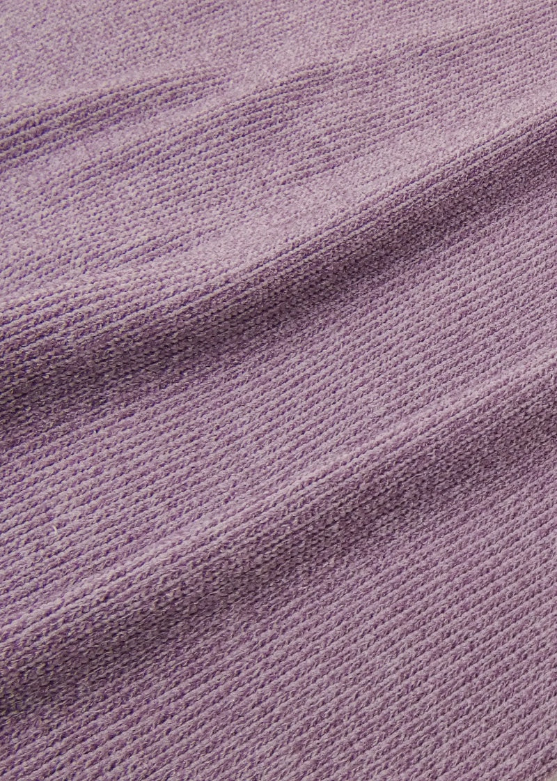 Knit detail on RubiaWear jumper in light purple.