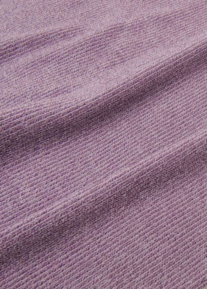 Knit detail on RubiaWear jumper in light purple.