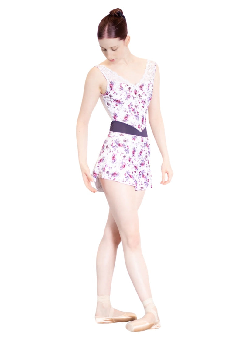 White short pull-on skirt with pink and purple floral print.