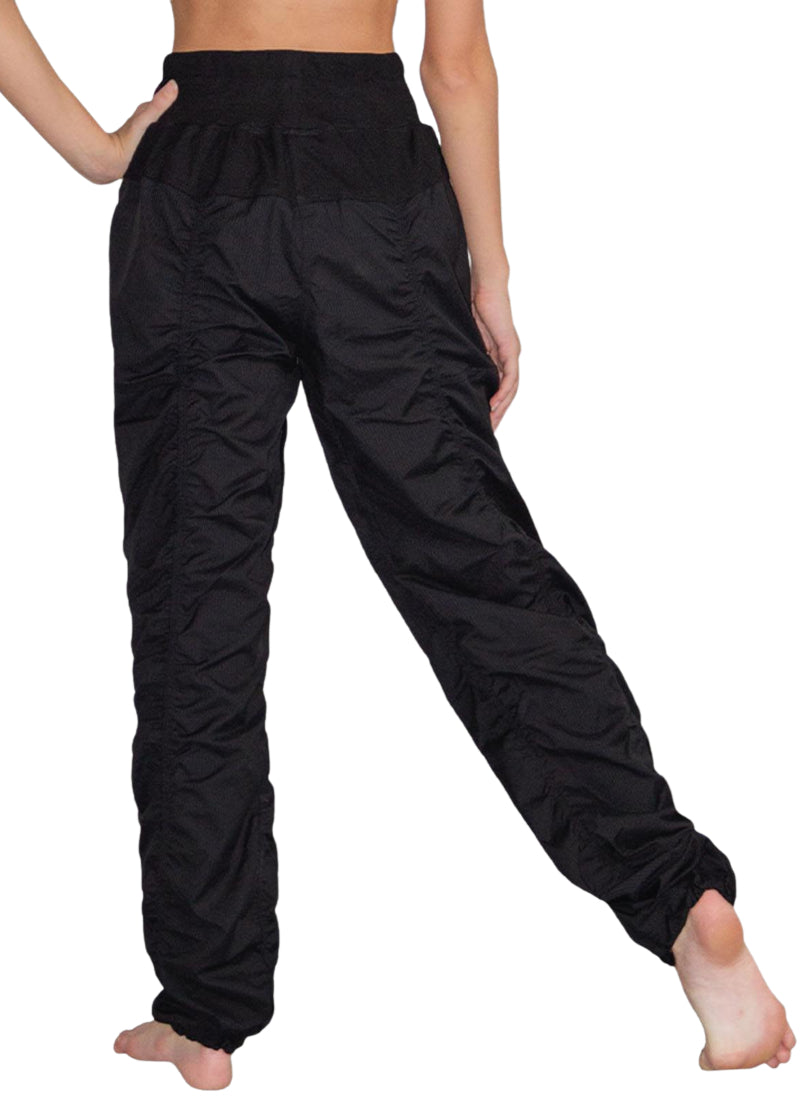 So Danca SP01 Women's lightweight and stretchy full-length Studio Pants in Black with wide drawstring waistband and hem drawcords for a fully customizable fit, shown on a dancer