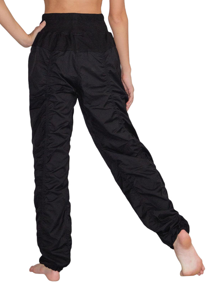 So Danca SP01 Women's lightweight and stretchy full-length Studio Pants in Black with wide drawstring waistband and hem drawcords for a fully customizable fit, shown on a dancer