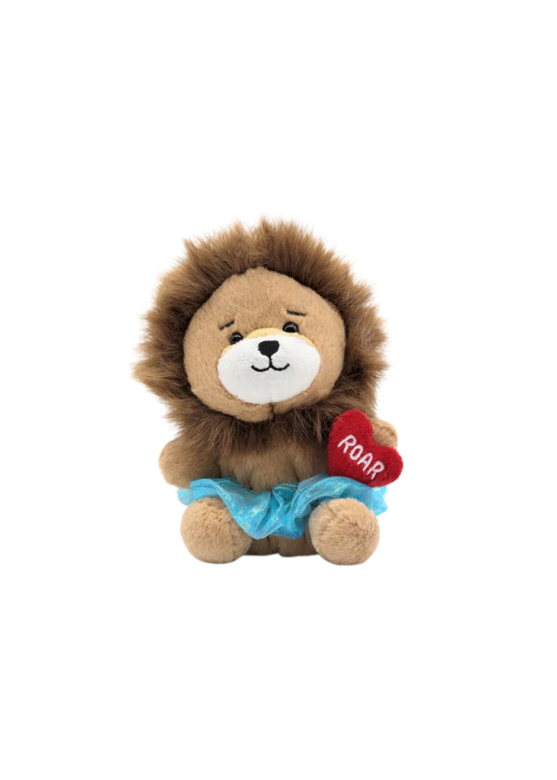 Dasha lion plushie with blue scrunchy tutu, holding a red heart with "ROAR" embroidered in white.