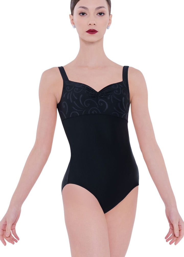 Wear Moi women's Fereni tank leotard in black with pinch front neckline, empire waistline, and black swirl patterned bust.