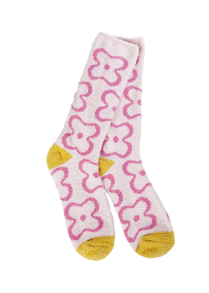 light pink fuzzy socks with hot pink cartoon flowers and yellow accents
