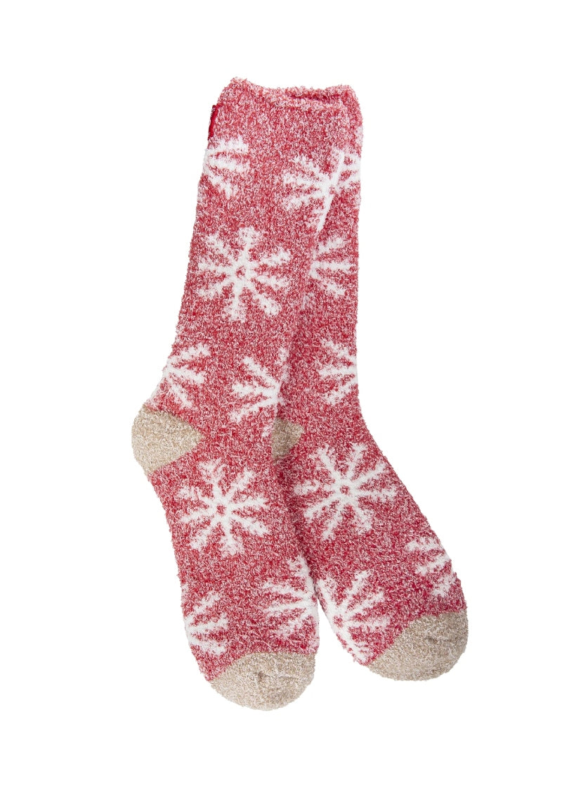 red fuzzy socks with snowflake pattern
