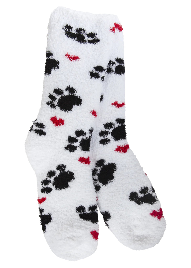 White fuzzy socks with black paw prints and red hearts.