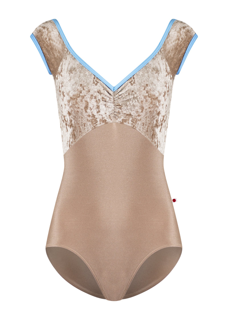 Yumiko Elli cap sleeve leotard in tan, with crushed velvet bodice and light blue trim.