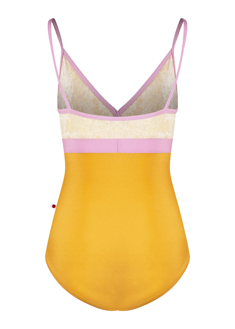 Yumiko Zoe camisole leotard with yellow bottom, cream crushed velvet top, and pink waistband and trim/straps.