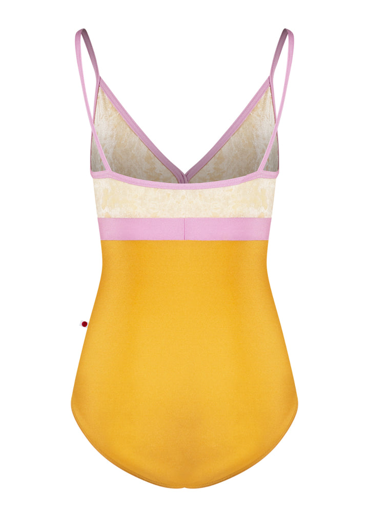 Yumiko Zoe camisole leotard with yellow bottom, cream crushed velvet top, and pink waistband and trim/straps.