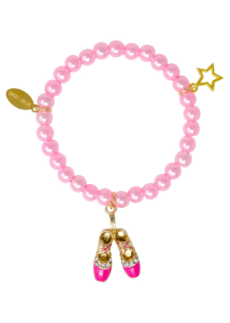 Beaded charm bracelet with pink beads, pink ballet shoes charm, and star charm.